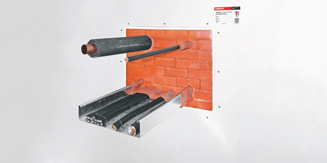 Photo of CFS-BL Firestop blocks being used in a mixed penetration of pipe, cables and a cable tray, then sealed using CFS-F FX Firestop foam.