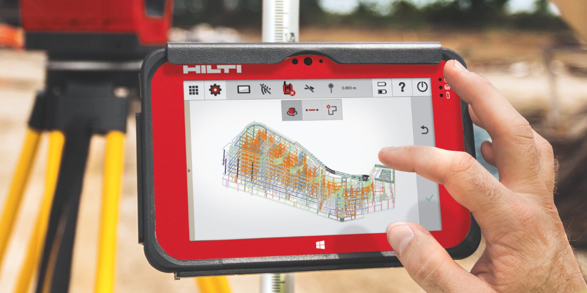 Two workers onsite using a Total Station layout tool and BIM-ready tablet to position MEP supports